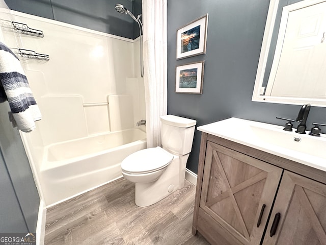 112 Little River Ct, Eatonton, GA 31024 - bathroom featuring shower / tub combo, baseboards, toilet, wood finished floors, and vanity