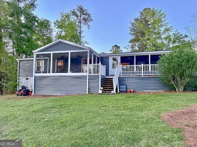 112 Little River Ct, Eatonton, GA 31024 - view of front facade with a ceiling fan, a front yard, a sunroom, and stairs
