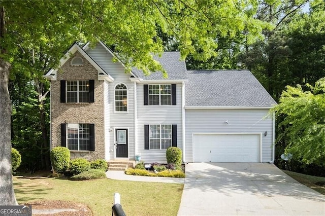 colonial house with an attached garage, a shingled roof, a front lawn, and driveway