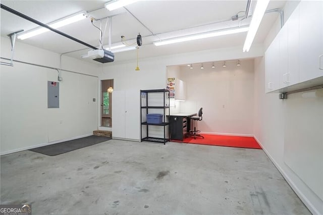 garage with electric panel and a garage door opener