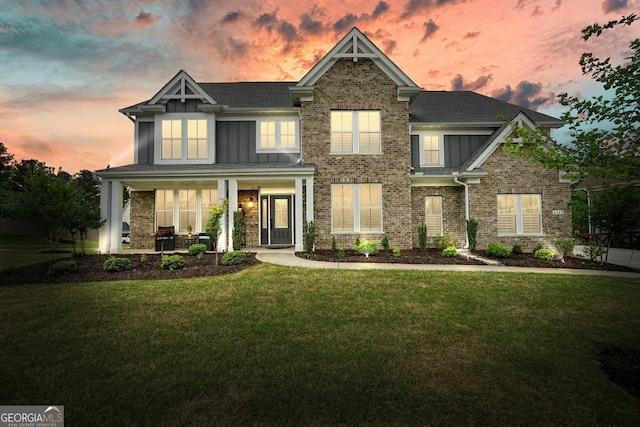 2127 Harmony Dr, Canton, GA 30115 - craftsman-style home featuring covered porch, a front lawn, board and batten siding, and brick siding
