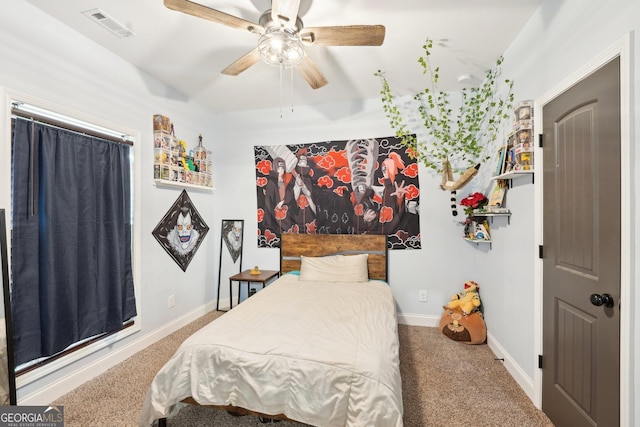 bedroom featuring visible vents, a ceiling fan, carpet, and baseboards