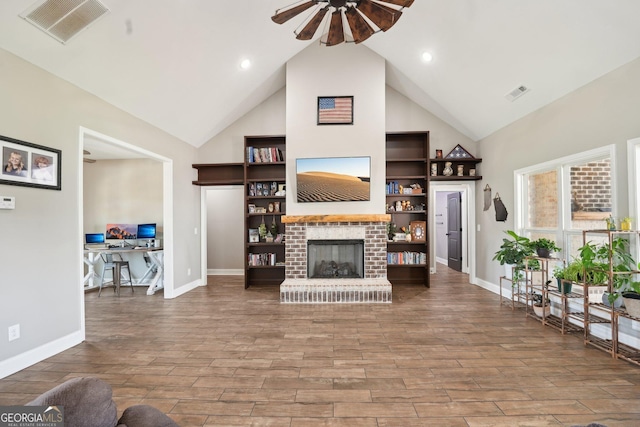 living room with visible vents, ceiling fan, wood finished floors, and high vaulted ceiling