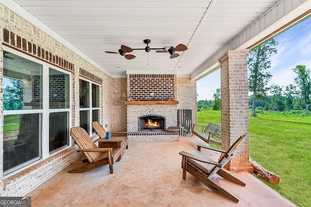 view of patio / terrace with ceiling fan and an outdoor brick fireplace