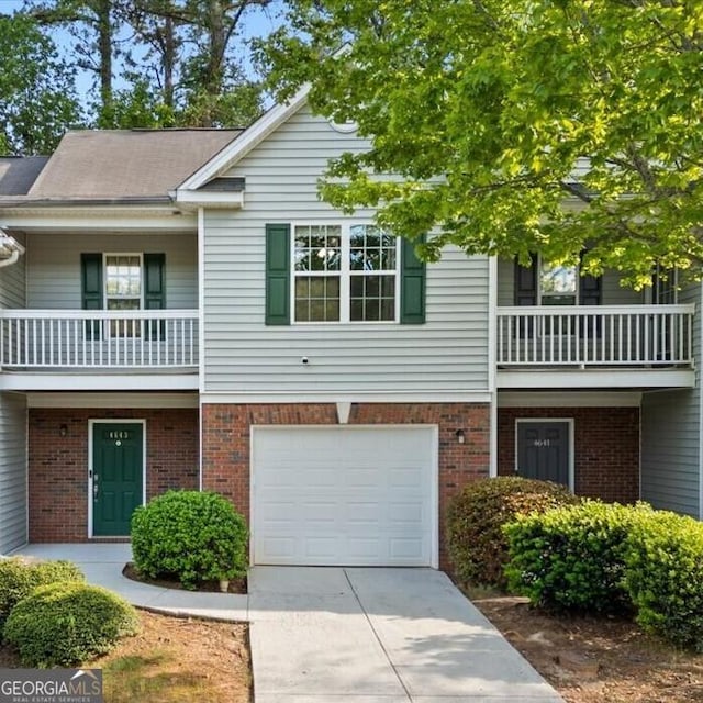 4643 Grand Central Pkwy, Decatur, GA 30035 - multi unit property with a garage, a balcony, brick siding, and driveway