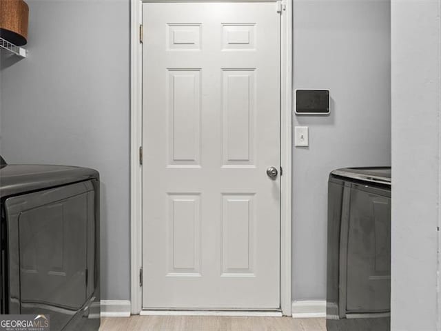 4643 Grand Central Pkwy, Decatur, GA 30035 - clothes washing area with washing machine and dryer and baseboards