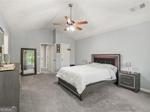 4643 Grand Central Pkwy, Decatur, GA 30035 - carpeted bedroom featuring baseboards, vaulted ceiling, and ceiling fan