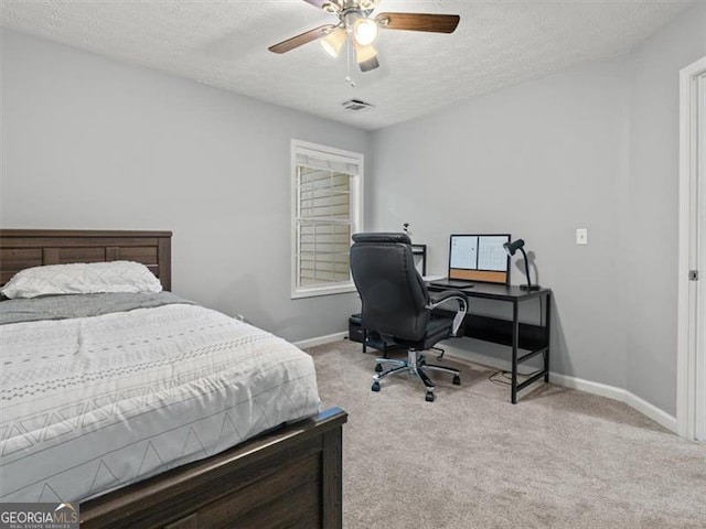 4643 Grand Central Pkwy, Decatur, GA 30035 - bedroom featuring carpet, baseboards, an office area, a textured ceiling, and a ceiling fan