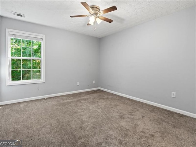 4643 Grand Central Pkwy, Decatur, GA 30035 - carpeted spare room featuring a ceiling fan, a textured ceiling, and baseboards