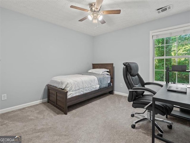 4643 Grand Central Pkwy, Decatur, GA 30035 - bedroom featuring a desk, carpet, a textured ceiling, baseboards, and ceiling fan