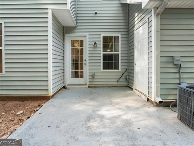 4643 Grand Central Pkwy, Decatur, GA 30035 - doorway to property with central air condition unit and a patio