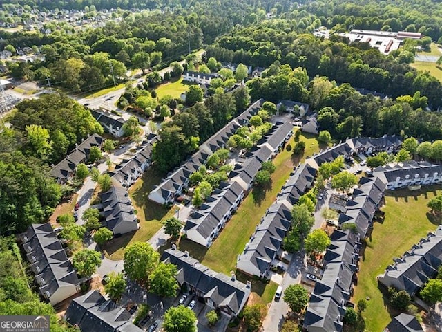 4643 Grand Central Pkwy, Decatur, GA 30035 - aerial overview of property's location with a forest and nearby suburban area