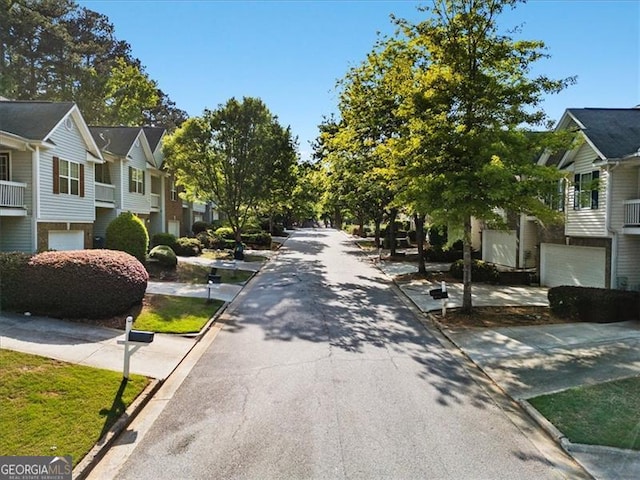 4643 Grand Central Pkwy, Decatur, GA 30035 - view of asphalt road featuring curbs and a residential view