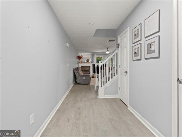4643 Grand Central Pkwy, Decatur, GA 30035 - corridor with light wood-style flooring, baseboards, and stairs