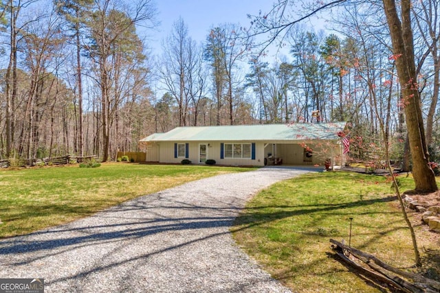 84 Weatherly Rd, Clarkesville, GA 30523 - ranch-style house featuring gravel driveway, a front yard, and a carport