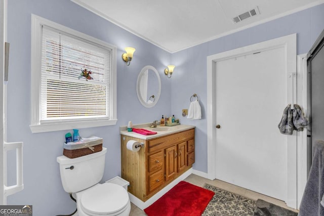 84 Weatherly Rd, Clarkesville, GA 30523 - full bath with tile patterned floors, visible vents, toilet, vanity, and ornamental molding
