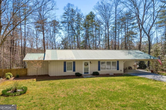 84 Weatherly Rd, Clarkesville, GA 30523 - view of front of home with a carport, driveway, metal roof, fence, and a front yard