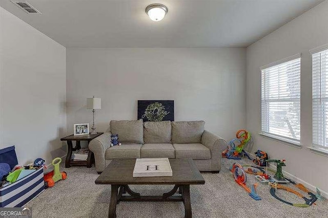 living room featuring carpet flooring and visible vents