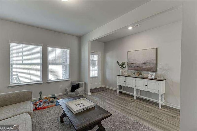 living room featuring wood finished floors and baseboards