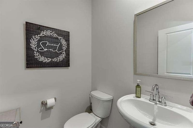 bathroom with a sink and toilet