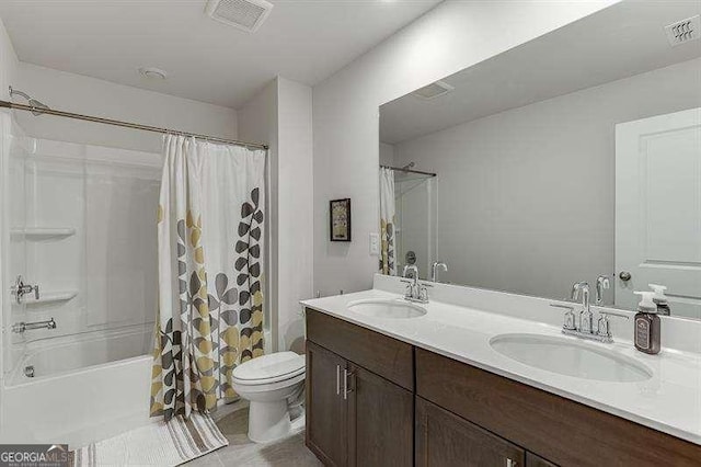 bathroom featuring shower / bath combination with curtain, visible vents, toilet, and a sink