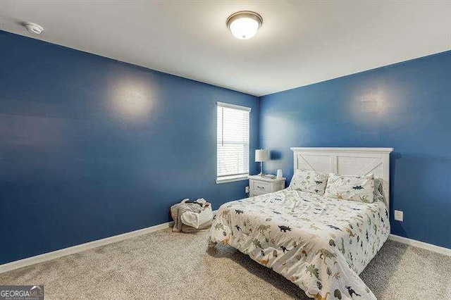 carpeted bedroom with baseboards