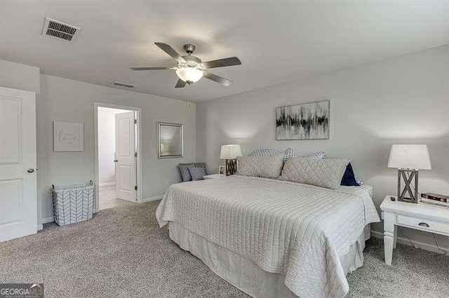 bedroom with baseboards, visible vents, carpet, and ceiling fan