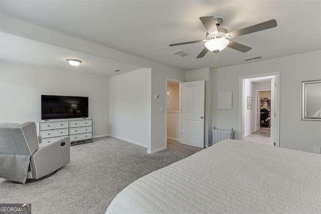 carpeted bedroom featuring visible vents, baseboards, and ceiling fan
