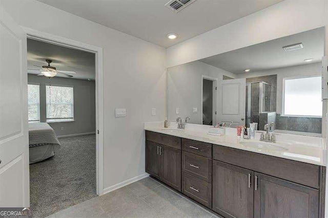 full bath featuring a healthy amount of sunlight, a sink, and connected bathroom