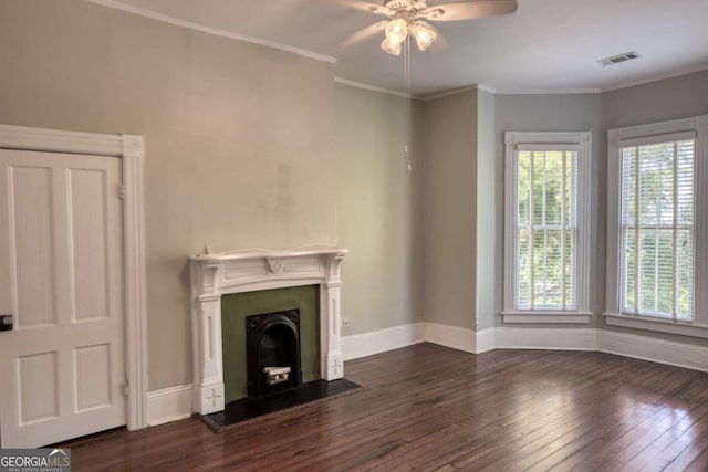 unfurnished living room with visible vents, dark wood-type flooring, baseboards, a fireplace, and ceiling fan