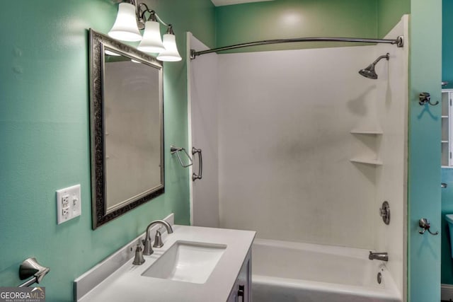 bathroom featuring toilet, vanity, and shower / bathing tub combination