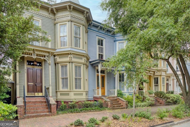 italianate-style house with entry steps