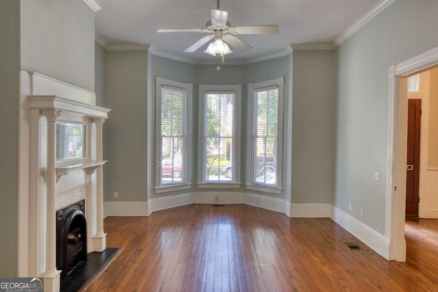 unfurnished living room with baseboards, a ceiling fan, and hardwood / wood-style floors