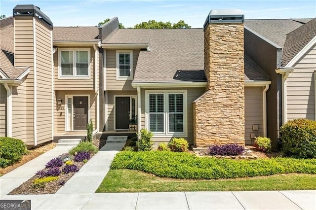 1420 Defoors Dr NW, Atlanta, GA 30318 - view of front of property with stone siding, a chimney, and roof with shingles