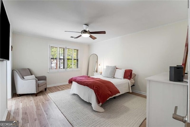 1420 Defoors Dr NW, Atlanta, GA 30318 - bedroom with a ceiling fan, baseboards, crown molding, and light wood-style flooring