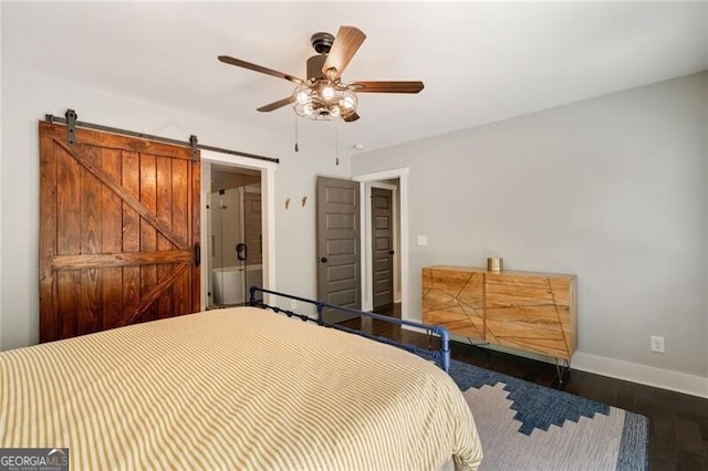 1535 Deerwood Dr, Decatur, GA 30030 - bedroom with baseboards, wood finished floors, ceiling fan, and a barn door