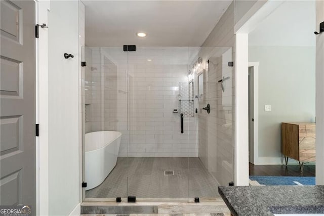 1535 Deerwood Dr, Decatur, GA 30030 - full bath with a shower stall, baseboards, a freestanding tub, and recessed lighting