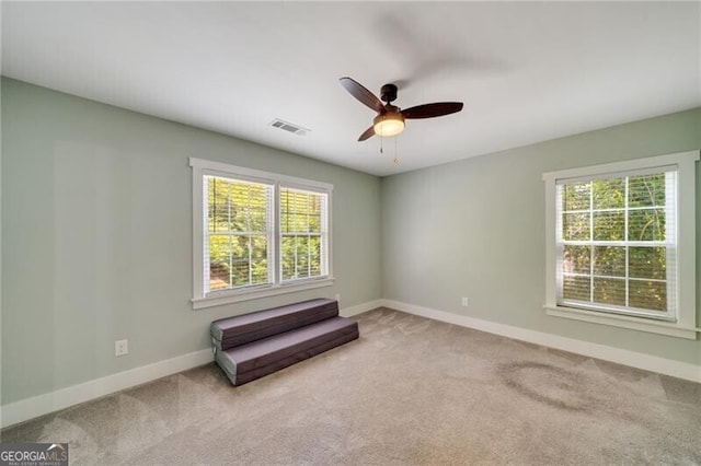 1535 Deerwood Dr, Decatur, GA 30030 - carpeted empty room with visible vents, a ceiling fan, and baseboards