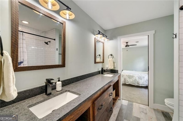 1535 Deerwood Dr, Decatur, GA 30030 - full bathroom featuring ceiling fan, wood finished floors, a sink, and double vanity