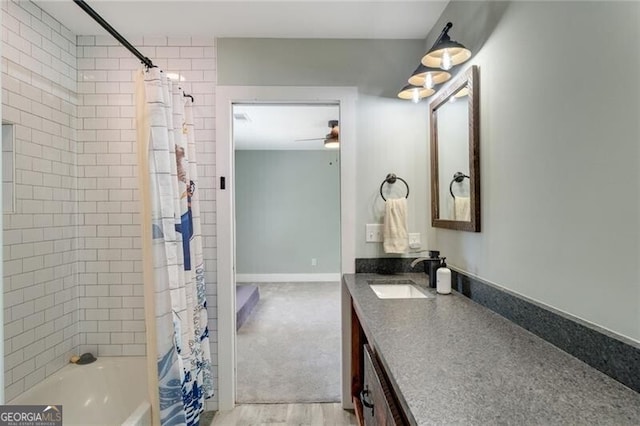 1535 Deerwood Dr, Decatur, GA 30030 - bathroom featuring vanity, shower / bathtub combination with curtain, and ceiling fan