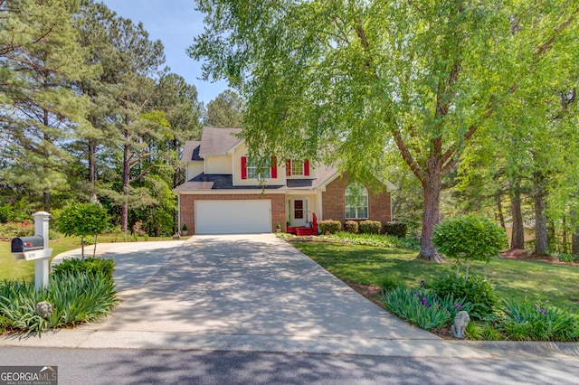 3095 Willow Park Dr, Dacula, GA 30019 - traditional home with a garage, a front lawn, brick siding, and concrete driveway