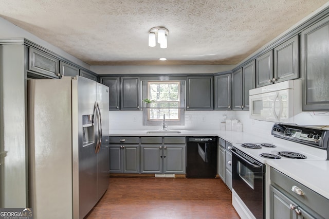 3095 Willow Park Dr, Dacula, GA 30019 - kitchen with a sink, stainless steel fridge, range with electric cooktop, gray cabinetry, and black dishwasher