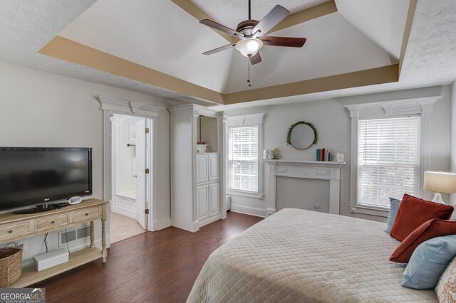 3095 Willow Park Dr, Dacula, GA 30019 - bedroom featuring a tray ceiling, dark wood-style floors, and multiple windows