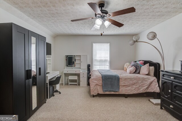 3095 Willow Park Dr, Dacula, GA 30019 - bedroom featuring a textured ceiling, a ceiling fan, and light colored carpet