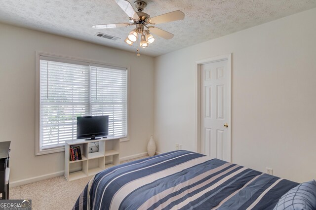 3095 Willow Park Dr, Dacula, GA 30019 - bedroom featuring visible vents, baseboards, a textured ceiling, carpet flooring, and ceiling fan