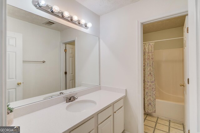 3095 Willow Park Dr, Dacula, GA 30019 - bathroom featuring tile patterned floors, a textured ceiling, vanity, shower / bathtub combination with curtain, and visible vents