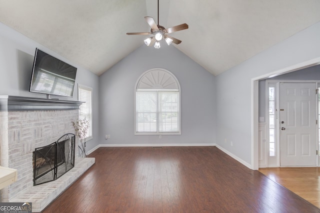 3095 Willow Park Dr, Dacula, GA 30019 - unfurnished living room with baseboards, a ceiling fan, wood finished floors, and a fireplace
