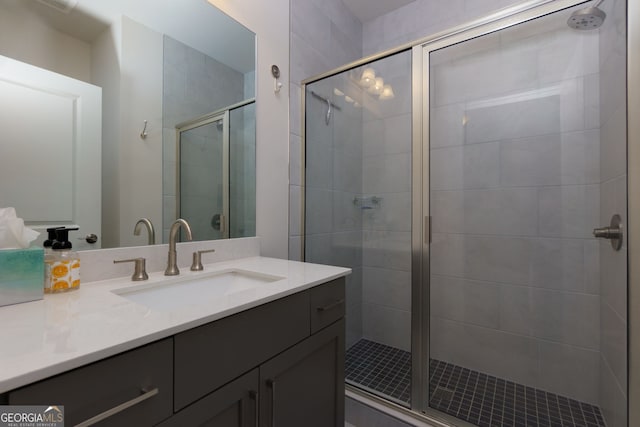 bathroom featuring a stall shower and vanity