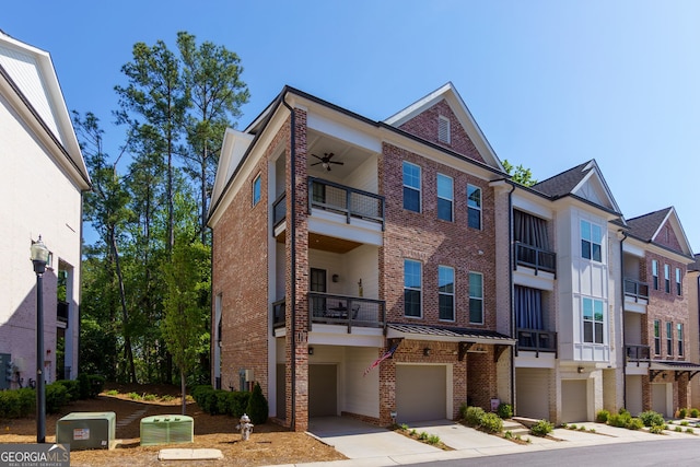 view of property featuring an attached garage and driveway