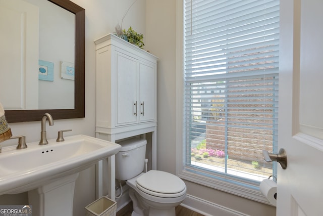 bathroom featuring toilet and a sink